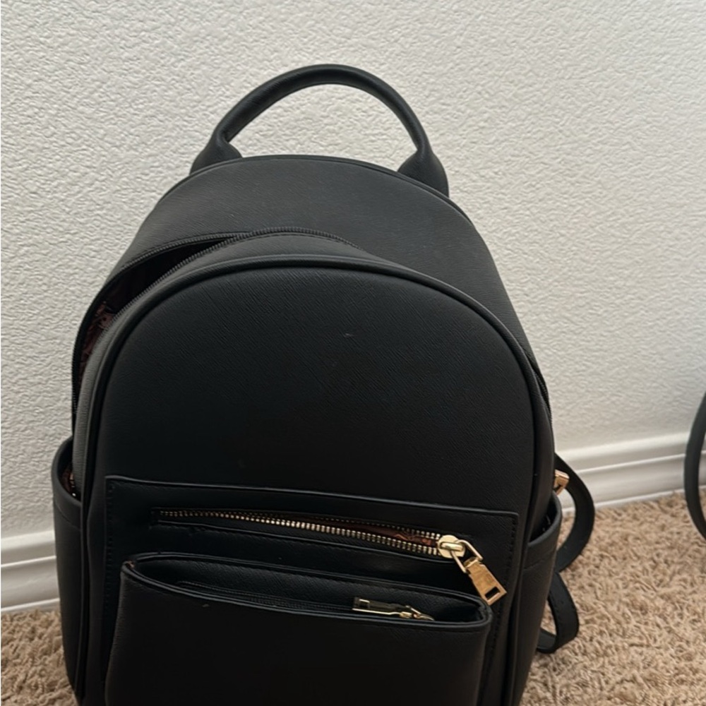 Black Backpack with Gold Accents